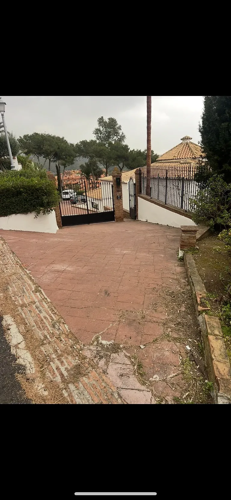 Second view of the driveway before resurfacing